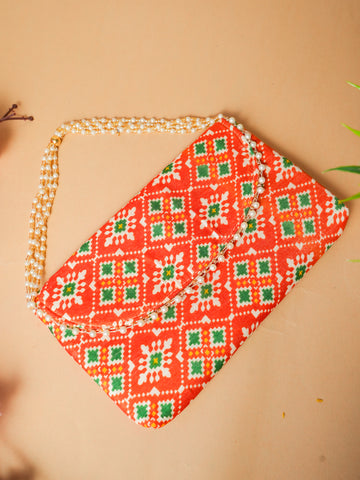 Chic Orange Patola Silk Clutch